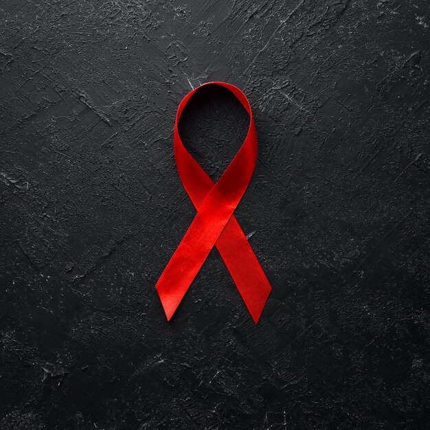 Símbolo de fita vermelha do Dia Mundial da AIDS Vista superior Espaço para cópia gratuita | Foto Premium